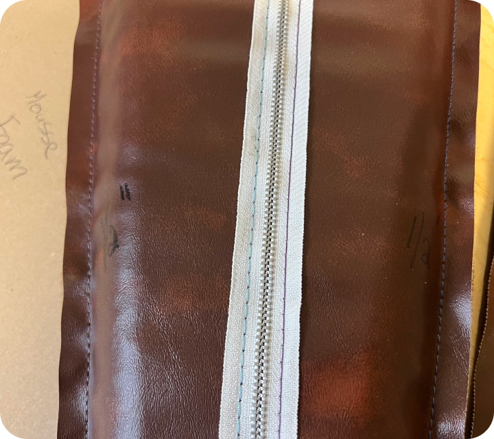 close-up of a padded element with visible central zipper