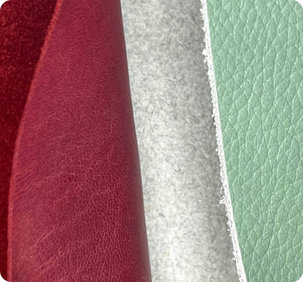 Full thickness red dyed leather on the left and worm dyed leather on the surface with contrasting pale grey backing