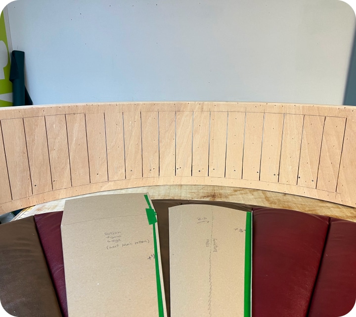 Rounded plywood panel with slots in the back.